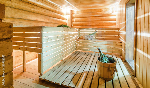 Russian sauna banya with water and birch broom photo