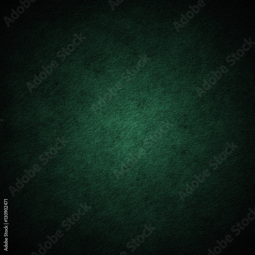Green scratched grunge stucco wall background or texture