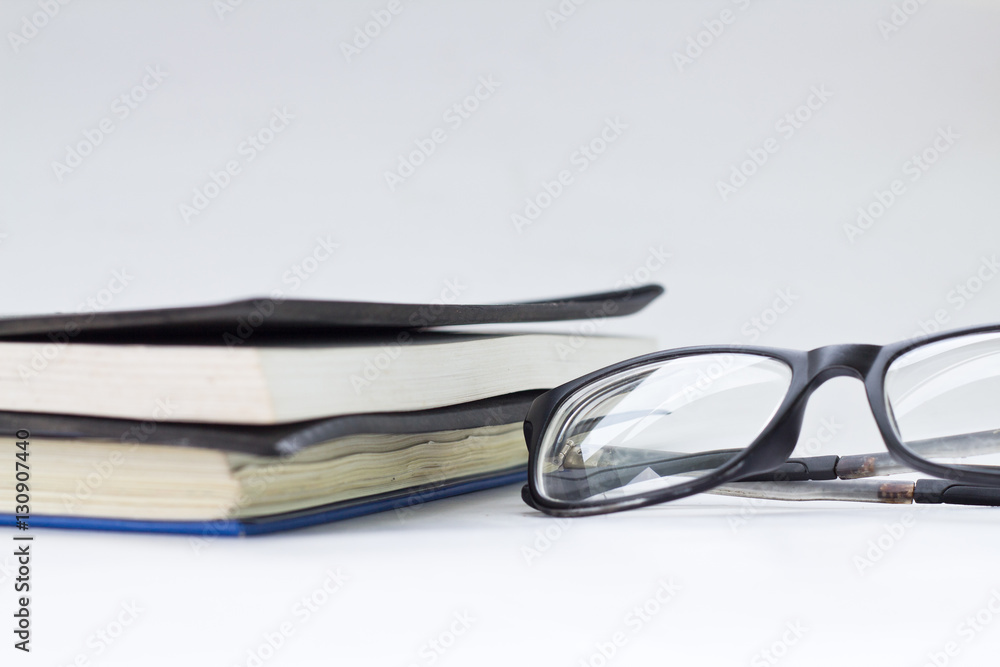 glasses and book isolated on white background. glasses and book isolated on white background.