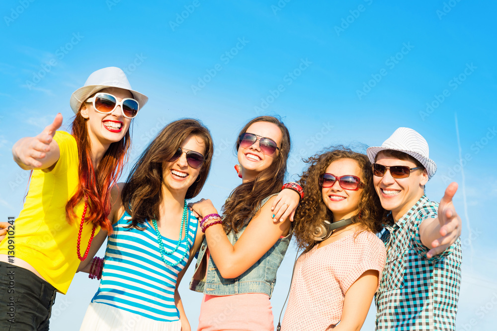 group of young people wearing sunglasses and hat group of young people wearing sunglasses and hat