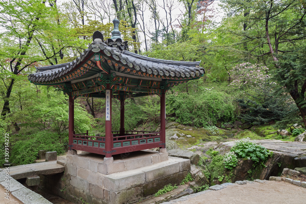 Ornate pavilion and verdant nature at Huwon (Secret Garden) at the Changdeokgung Palace in Seoul, South Korea. Ornate pavilion and verdant nature at Huwon (Secret Garden) at the Changdeokgung Palace in Seoul, South Korea.