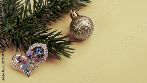  brooch with multi-colored crystals on a branch tree .New Year's still-life