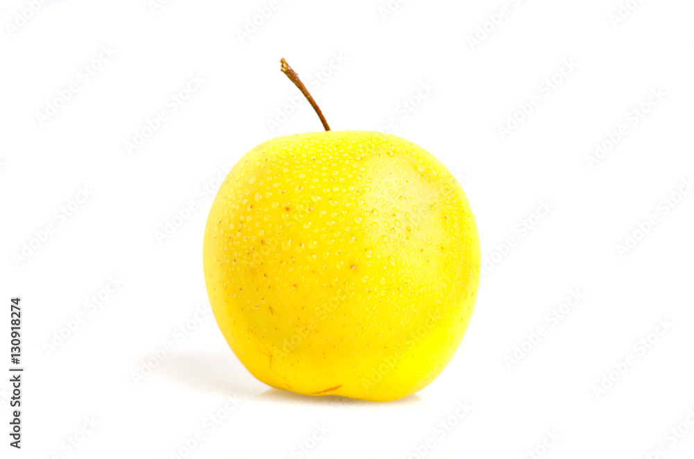 Golden apple with water drops closeup isolated on white Golden apple with water drops closeup isolated on white