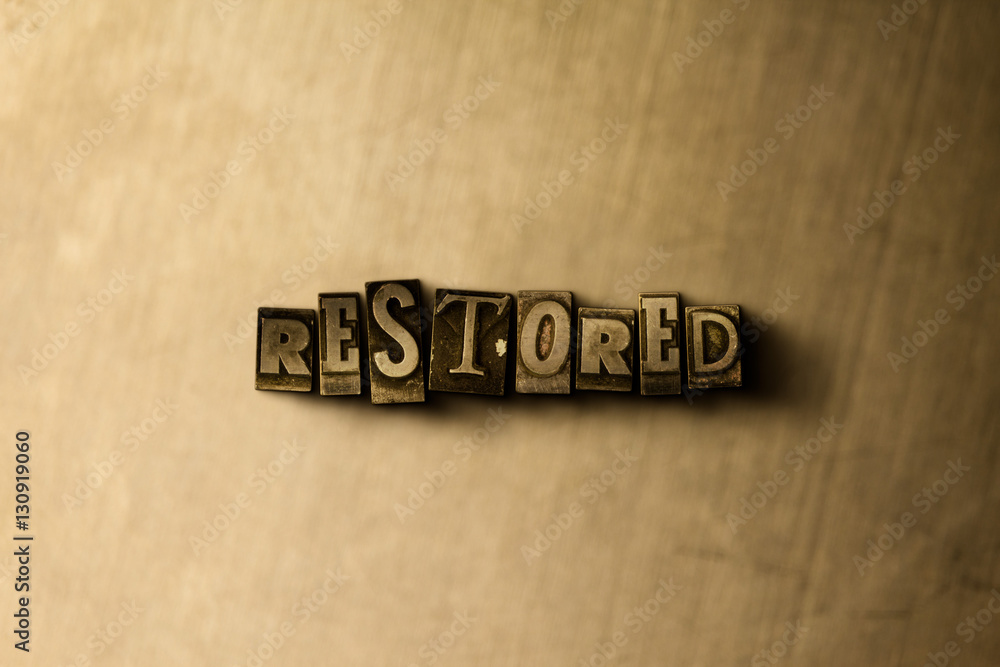 RESTORED - close-up of grungy vintage typeset word on metal backdrop ... - Restored Words