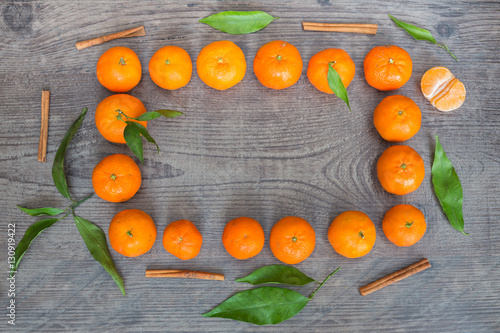 Fresh tangerines fruits on the place for inscription. photo