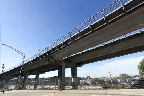 Elevated highway overpass with blue sky. Horizontal.