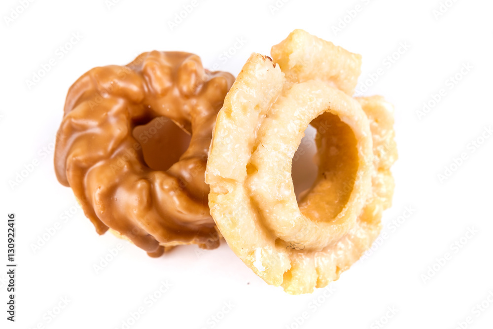 Assorted glazed and frosted donuts isolated on a white background Assorted glazed and frosted donuts isolated on a white background