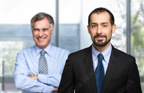 Two businessman sharing an office