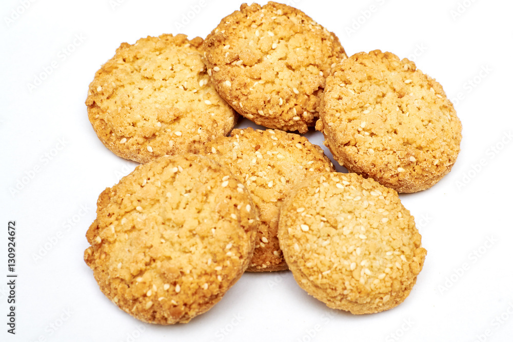 oatmeal cookies with sesame seeds on white background