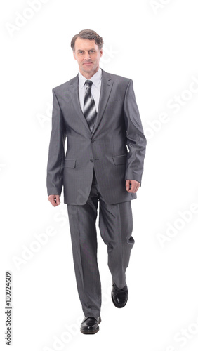 Businessman walking to success isolated on white background
