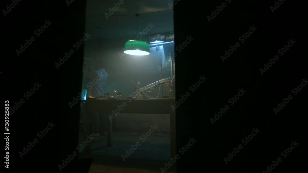 Strange scientist is preparing to work in laboratory Strange scientist is preparing to work in laboratory