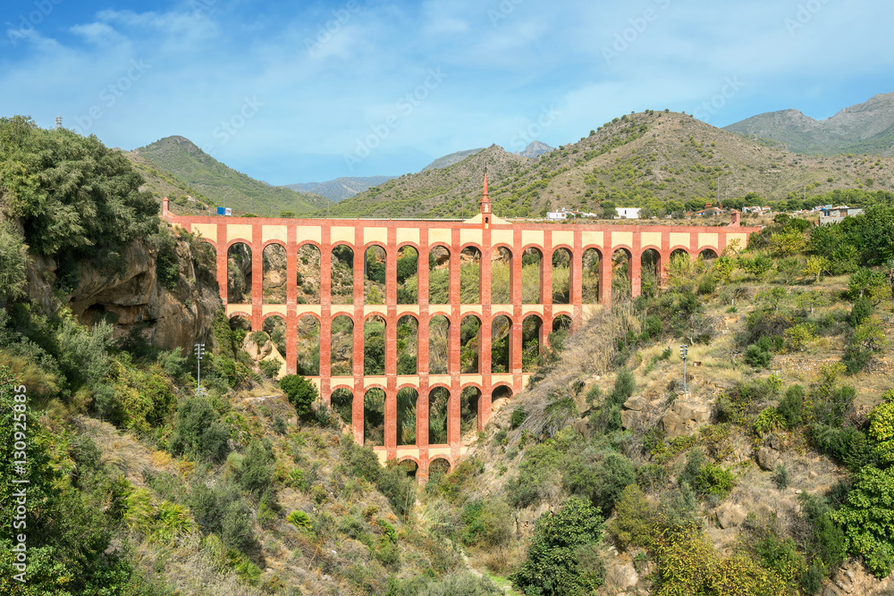Old aqueduct El Aguila (The Eagle) in Nerja. Malaga province, Sp