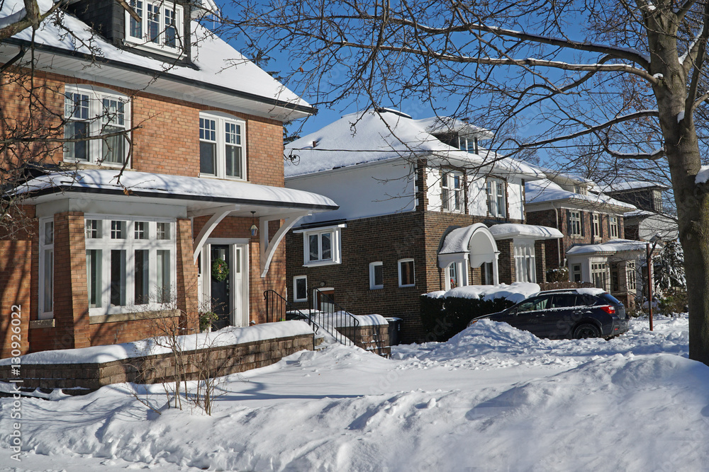 suburban street on a sunny day after a snow storm
