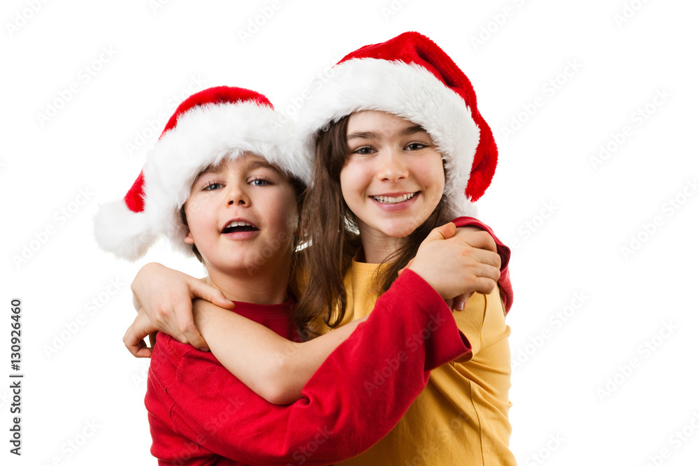 Christmas time - girl and boy with Santa Claus Hat Christmas time - girl and boy with Santa Claus Hat