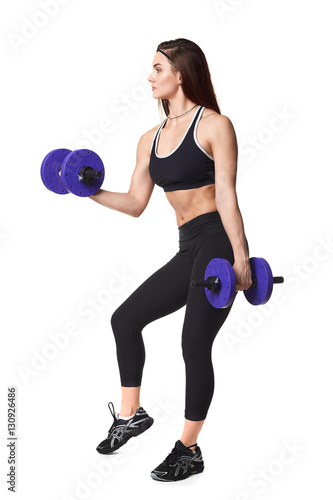 Athletic fitness woman helthy sport isolated white background young female health muscles copy space black clothes smilling attractive beautyful stretch activity copy space empty dumbbells