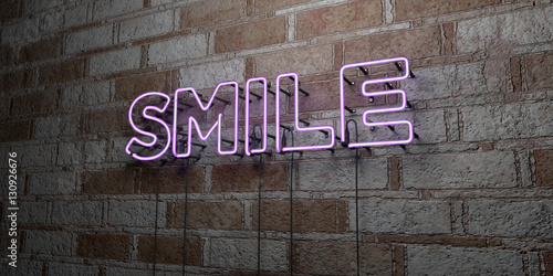 SMILE - Glowing Neon Sign on stonework wall - 3D rendered royalty free stock illustration.  Can be used for online banner ads and direct mailers..