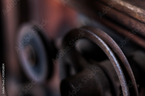 Close up of antique pulley with rust in historical American mill © Michael