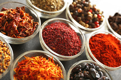 Various spices in glass bowls  closeup