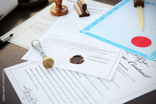 Old notarial wax seal and stamp on document, closeup