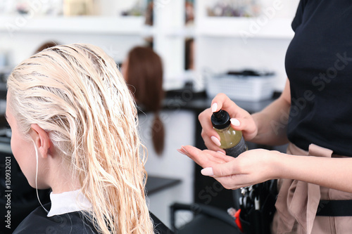 Hairdresser using balsam on...