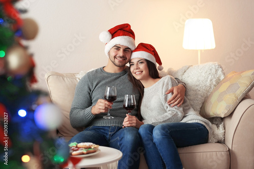 Young couple in Santa Claus...