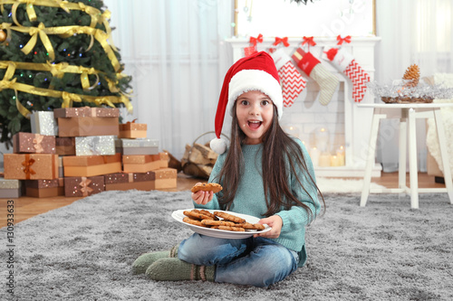 Cute little girl in Santa h...