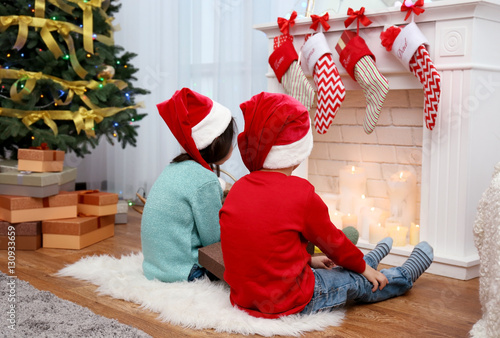Cute little kids in Santa h...
