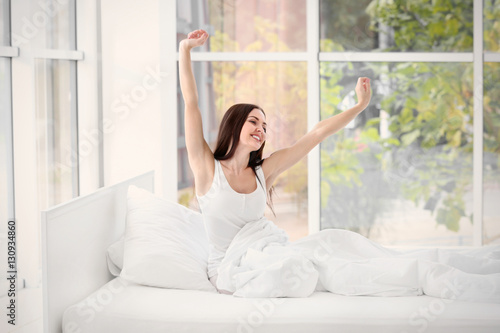 Young beautiful woman wakin...