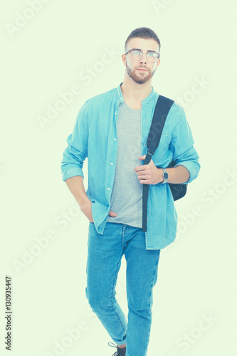 Male student with a school bag holding books isolated on white background