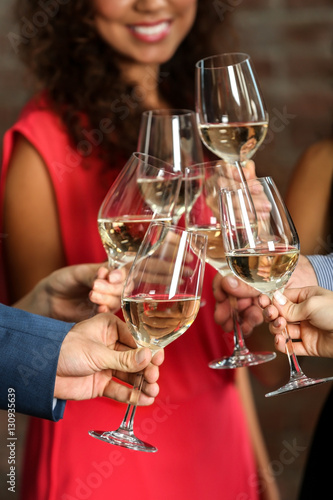 People toasting with glasse...