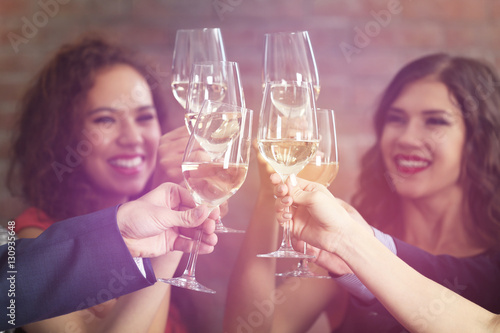 People toasting with glasse...