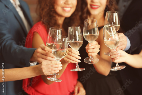 People toasting with glasse...