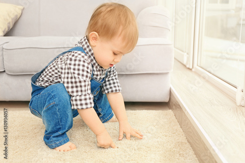 Adorable little boy playing...