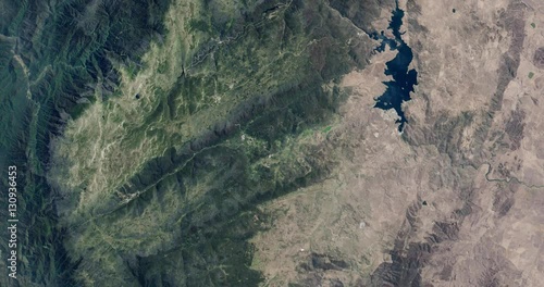High-altitude overflight aerial of the Snowy Mountains, New South Wales, Australia. Clip loops and is reversible. Elements of this image furnished by USGS/NASA Landsat