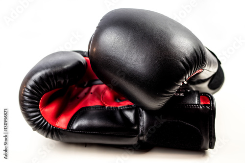 Black and Red Boxing Gloves on white background © frederikloewer