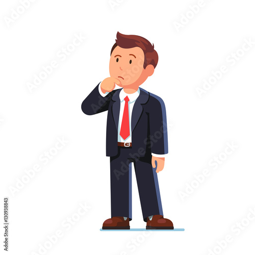 Standing business man making thinking gesture