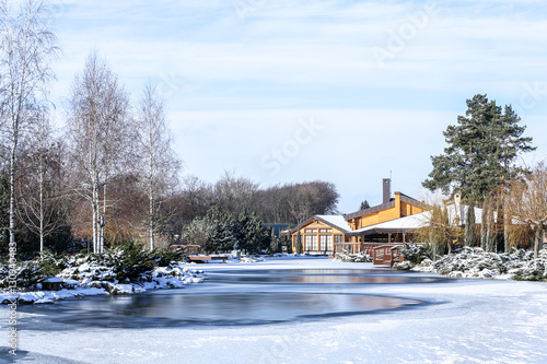 Beautiful park with lake on winter day