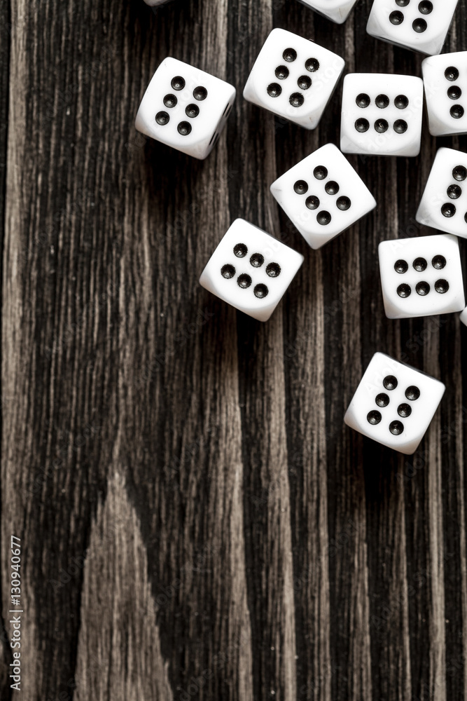 risk concept playing dice at dark wooden background top view risk concept playing dice at dark wooden background top view