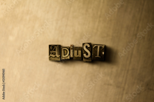 ADJUST - close-up of grungy vintage typeset word on metal backdrop. Royalty free stock - 3D rendered stock image. Can be used for online banner ads and direct mail. © Chris Titze Imaging