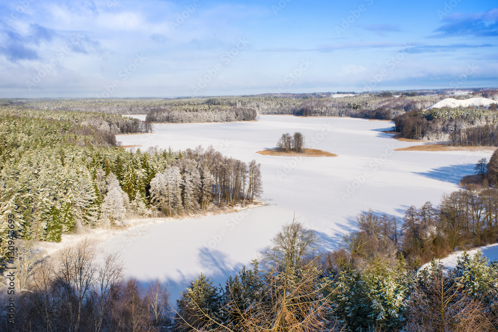 Frozen Lake Jedzelwo  in winter. Stare Juchy, Mauria, Poland.