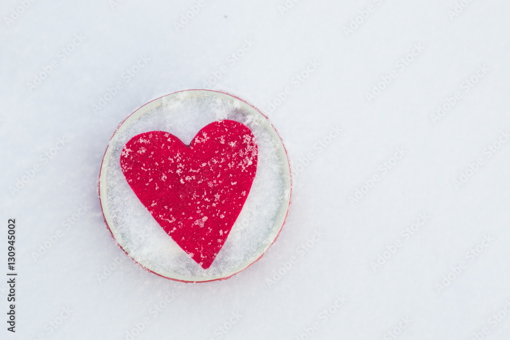 Red felt heart in a bowl on snow, Valentine's Day. Copy space for text. Snowflakes on heart. Valentines day, love concept. White background Red felt heart in a bowl on snow, Valentine's Day. Copy space for text. Snowflakes on heart. Valentines day, love concept. White background