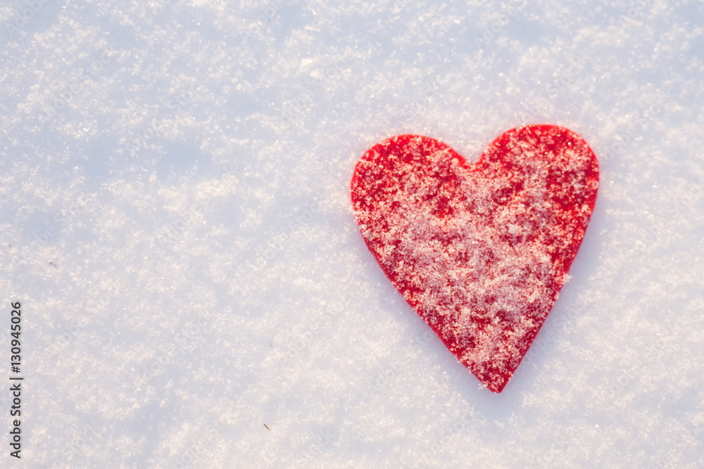 Red felt heart on snow, Valentine's Day. Copy space for text. Snowflakes on heart. Valentines day, love concept. White background Red felt heart on snow, Valentine's Day. Copy space for text. Snowflakes on heart. Valentines day, love concept. White background