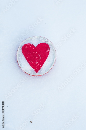 Red felt heart in a bowl on snow  Valentine s Day. Copy space for text. Snowflakes on heart. Valentines day  love concept. White background