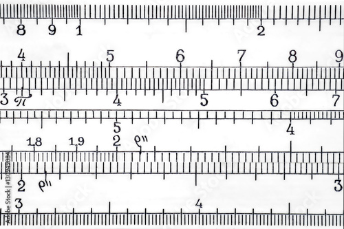 Fotografie Logarithmic scale of the slide rule extremal close up