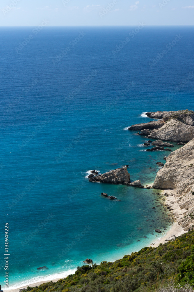Rocks and blue waters near Petani Beach, Kefalonia, Ionian Islands, Greece Rocks and blue waters near Petani Beach, Kefalonia, Ionian Islands, Greece