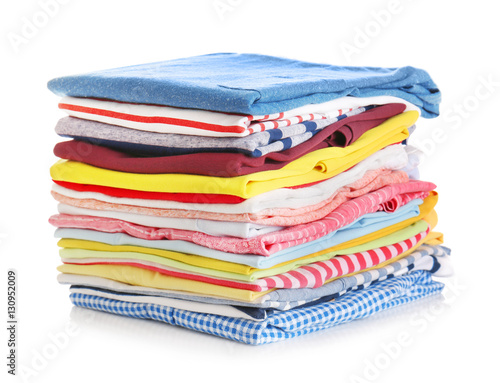 Stack of colorful clothes on white background, closeup