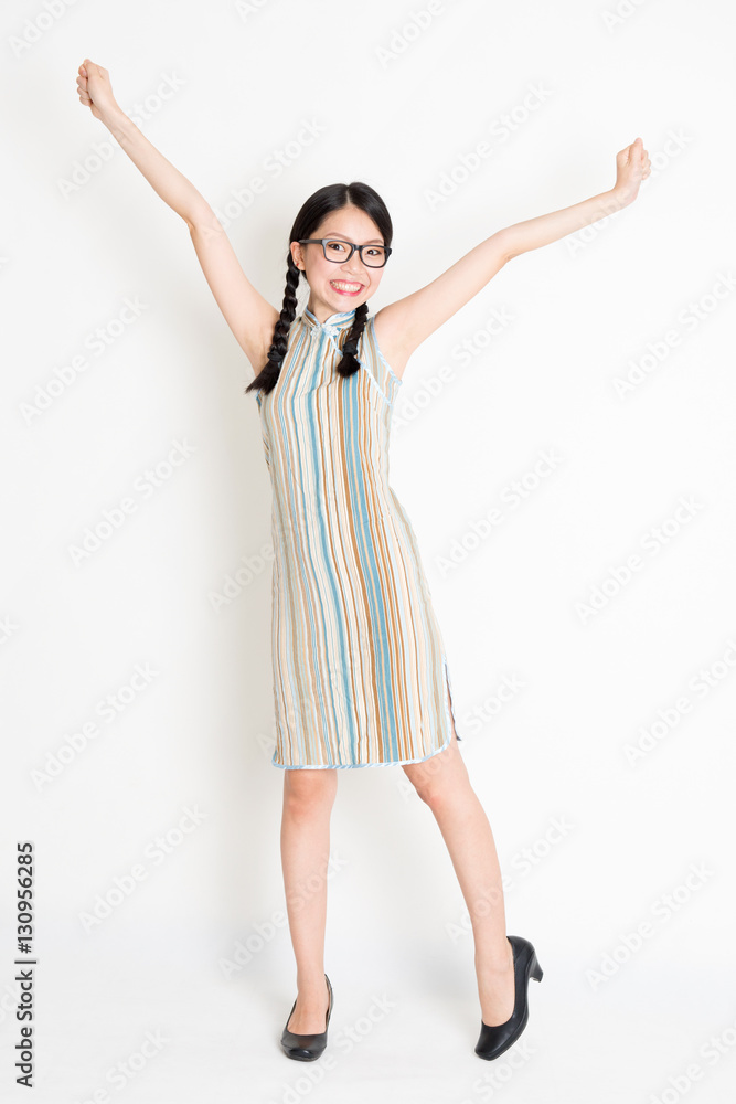 Excited Asian woman arms outstretched Excited Asian woman arms outstretched