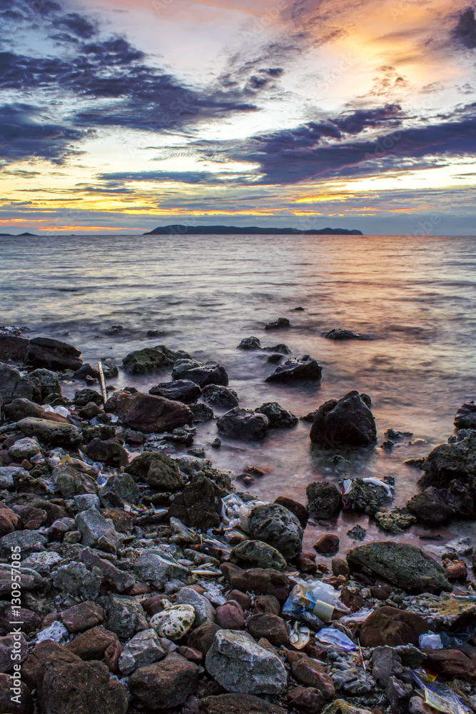 Island sea rock beach with twilight sunset sky landscape	