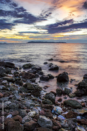 Island sea rock beach with twilight sunset sky landscape  © Sync