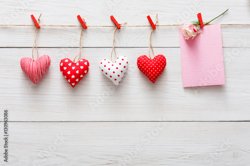 Valentine day background, paper hearts border on wood, copy space